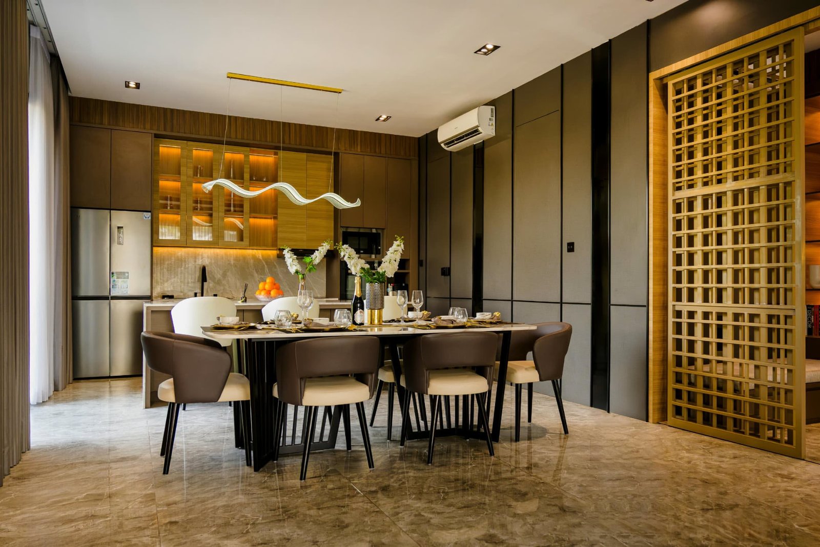 Elegant dining room with a marble-top table and brown leather chairs